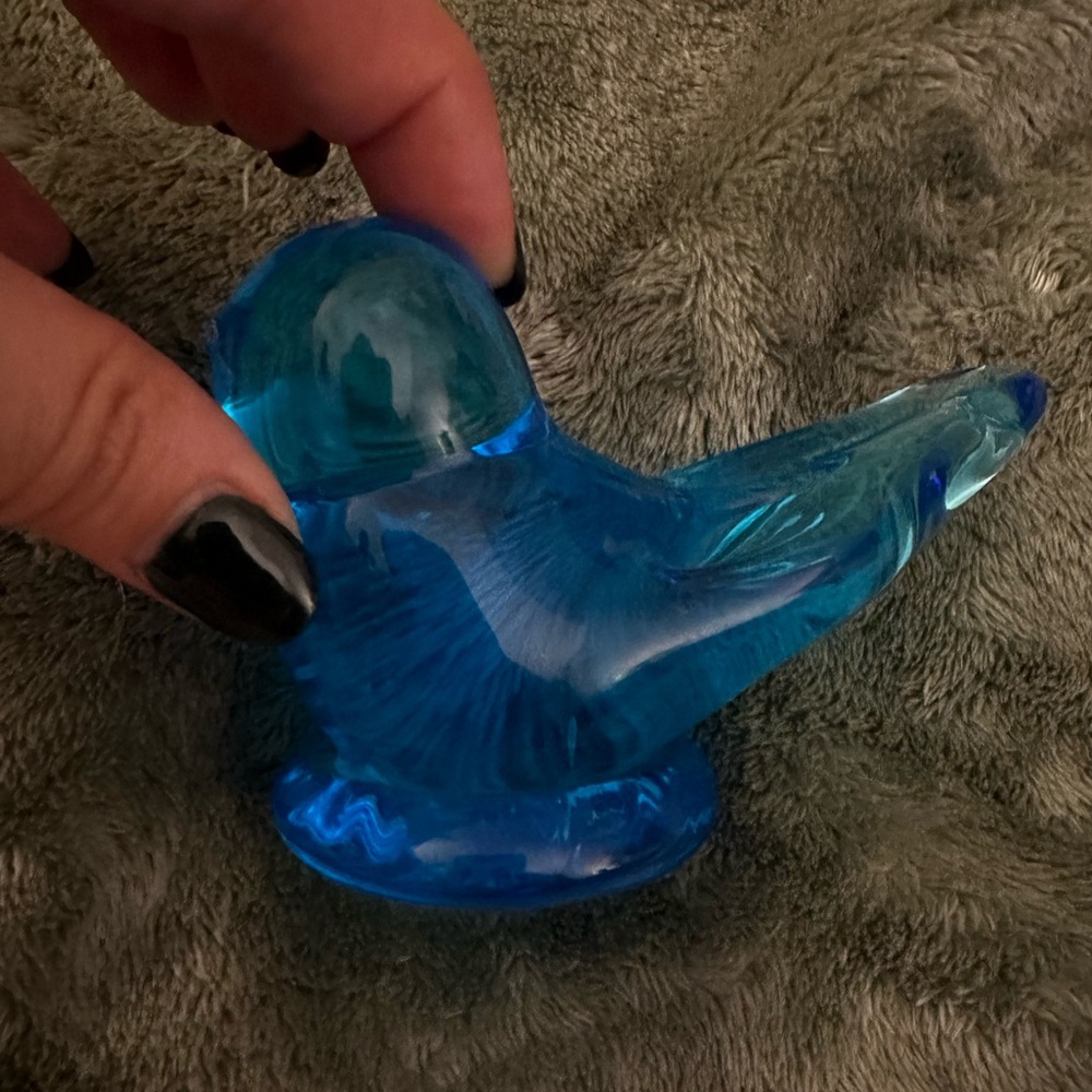 Glass blown blue bird paper weight.
